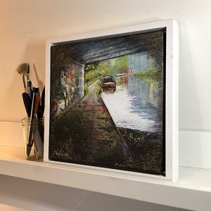 A painting of graffiti on a London canal bridge.