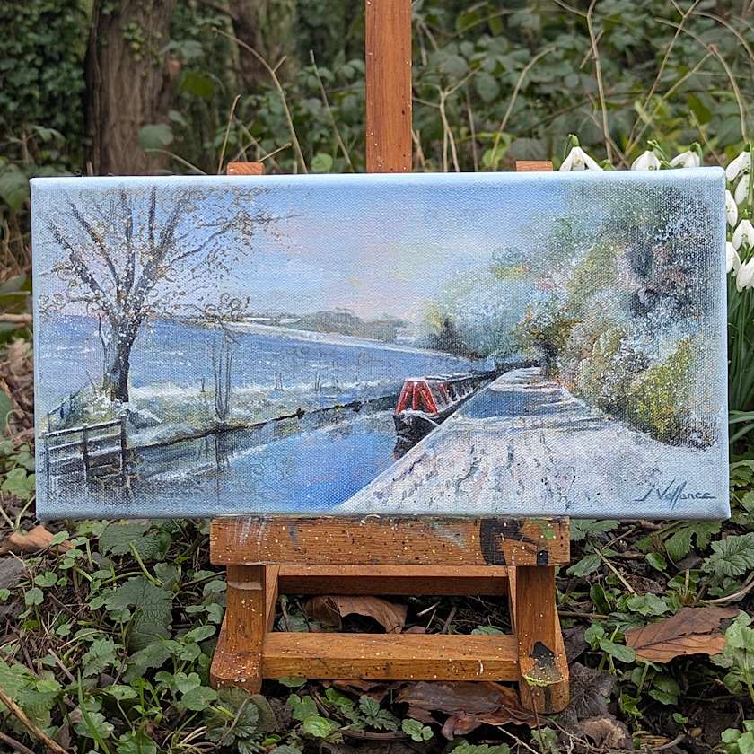 small landscape painting depicting a red narrowboat in snow